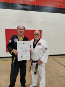 black belt promotion award for Master Instructor Richard "Mac" McCarthy