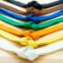 several color belts on a wooden surface